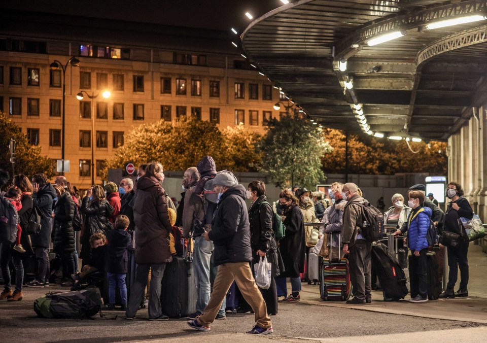 People were seen queuing up outside the Gare de Lyon as they tried to leave Paris