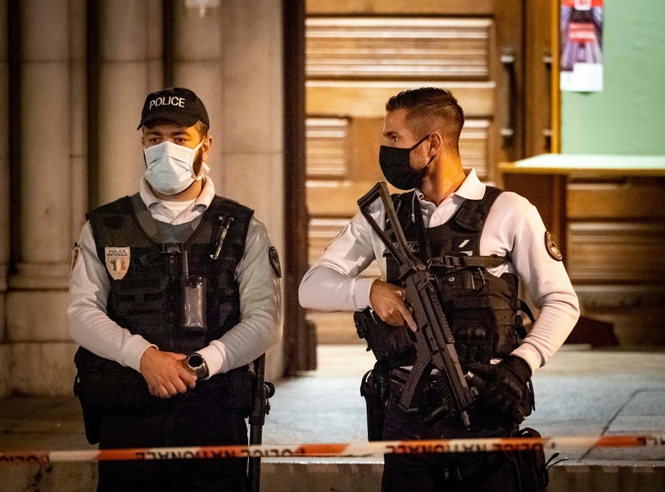 Armed police stand guard following the wave of violence