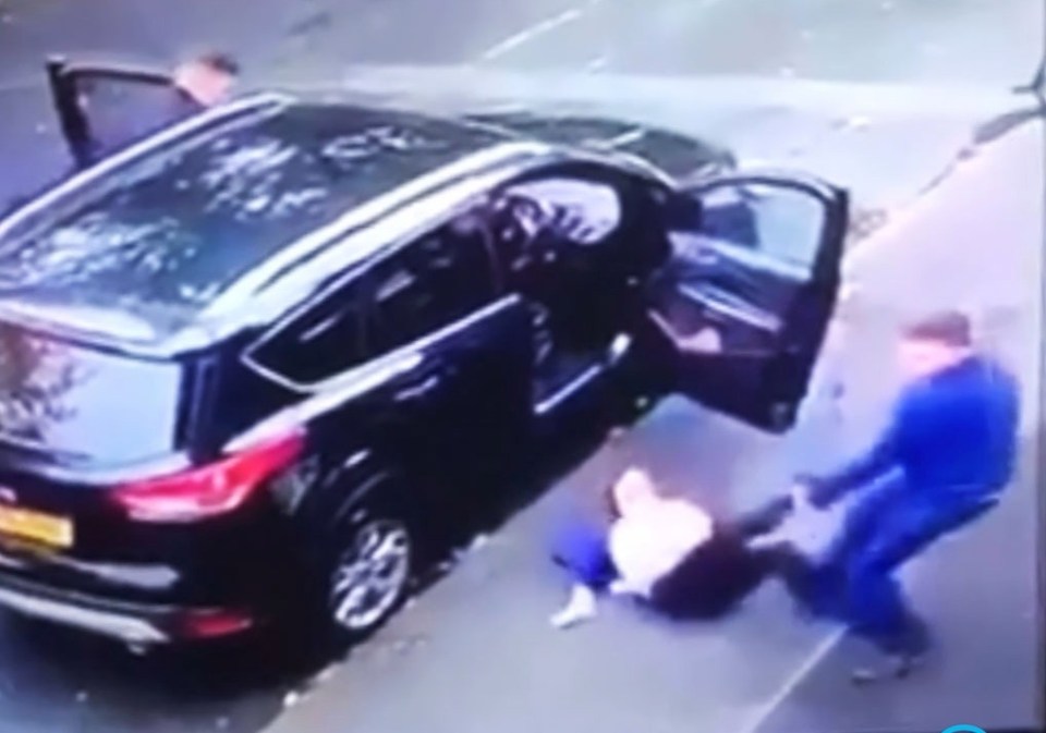 A woman was dragged from her car by thieves with her children still in the back - they then drove off with them