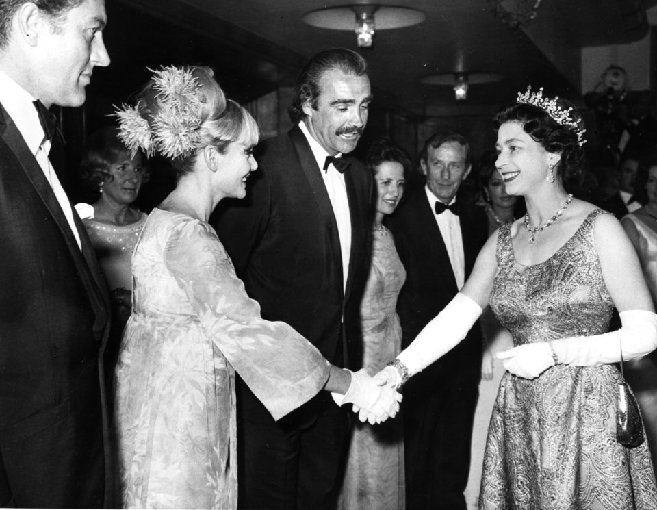 Connery is seen with wife Diane Cilento meeting Queen Elizabeth at the premiere for 'You Only Live Twice' in 1967