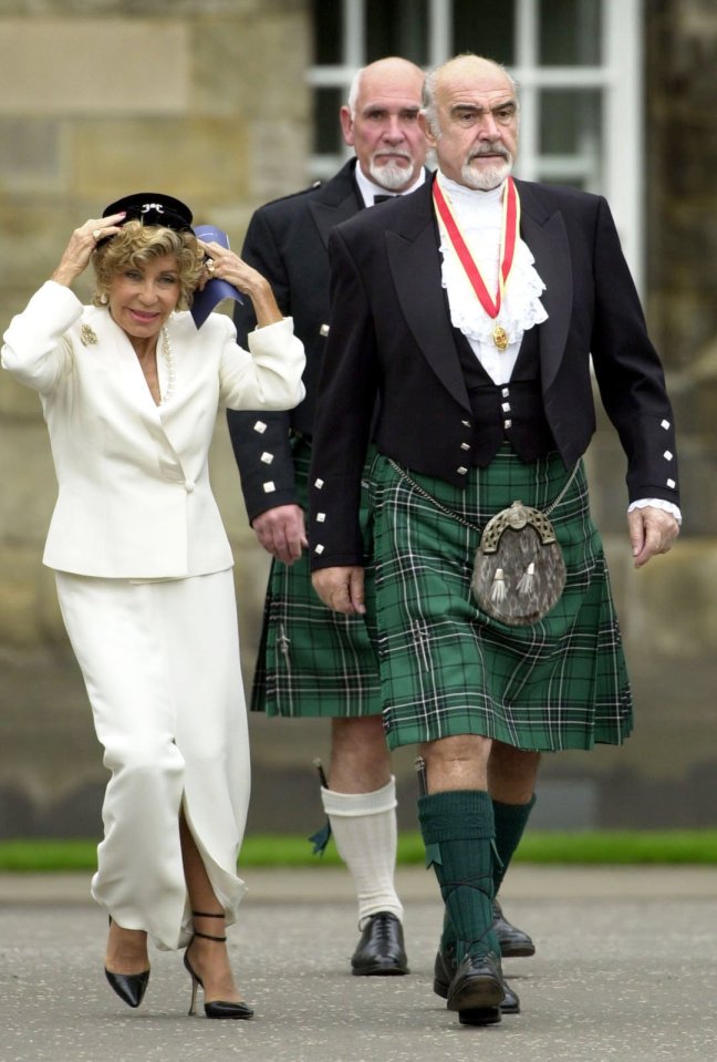 Sir Sean is seen alongside wife Micheline and brother Neil after being knighted during a ceremony at Holyrood palace