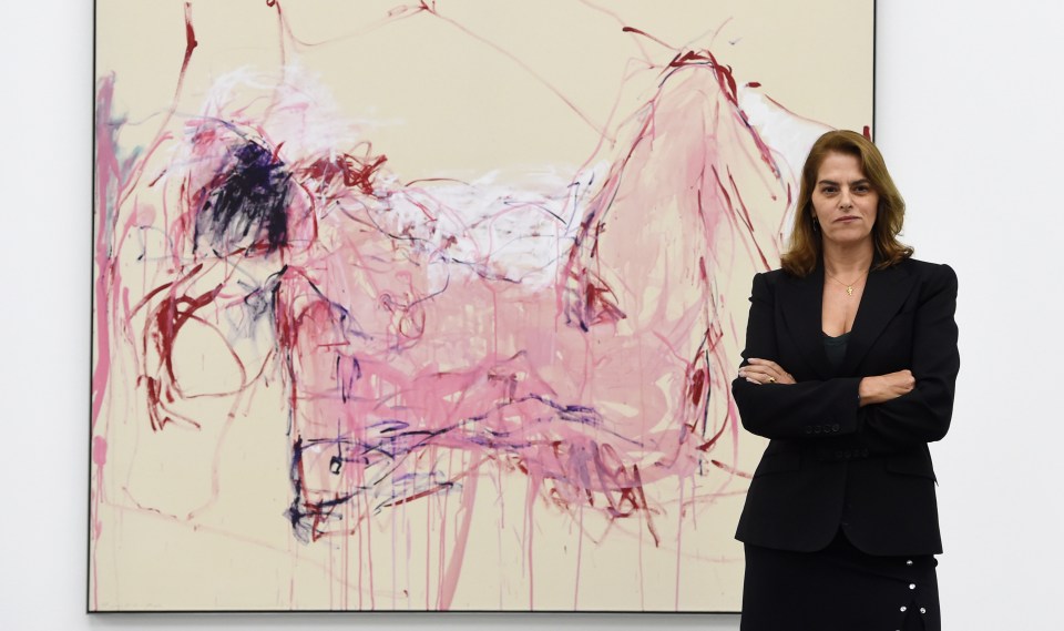 Tracey Emin poses for photographers next to her painting entitled It Was All Too Much