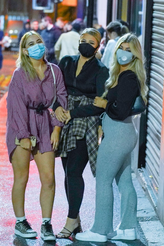 Students from the University of Sheffield on a night out while wearing face masks