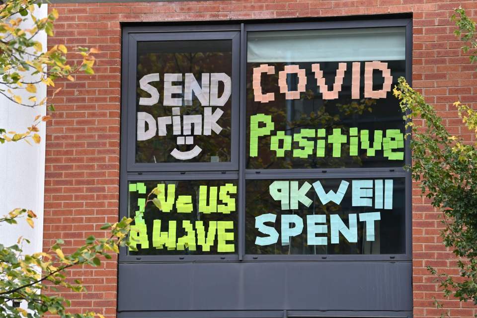 Messages are seen pasted inside the windows of student accommodation at Manchester Metropolitan University