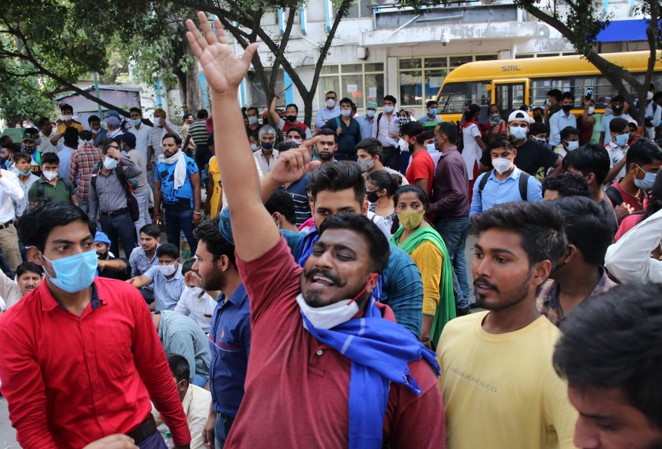 Indian activists shout slogans as they protest against the gang rape of a Dalit girl