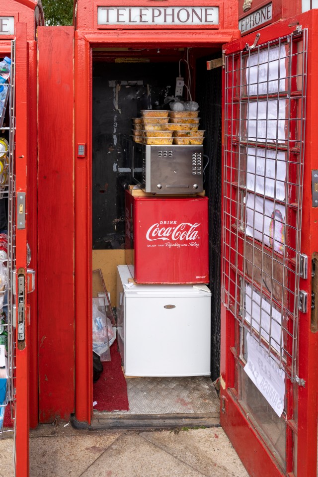 Tayyab gets the grub delivered twice a day and uses food warmers powered by electricity in the phone booth