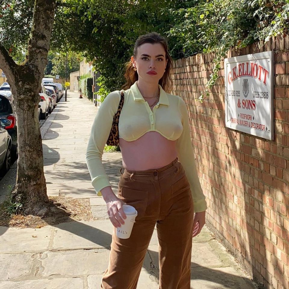 The model went braless as she posed up a storm in a London street