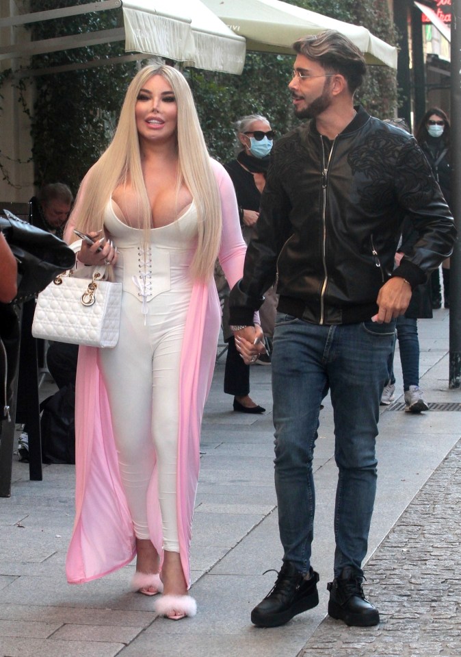 The ex-couple held hands as they strolled around the streets of Milan