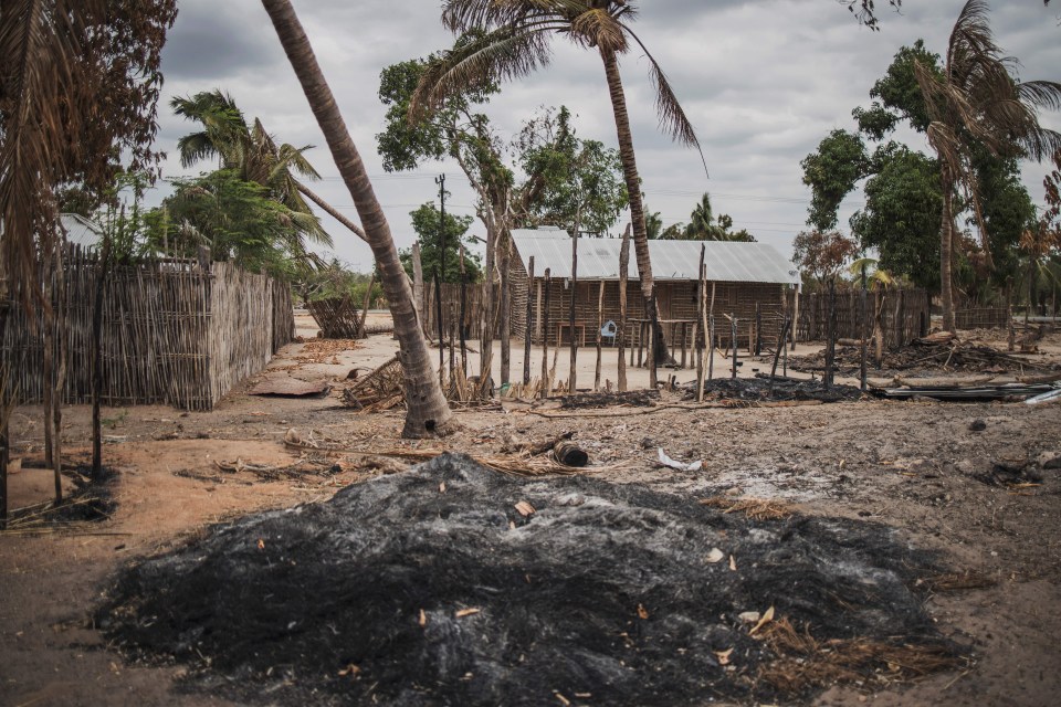 A mound of ashes in the attacked village of Aldeia da Paz in Mozambique