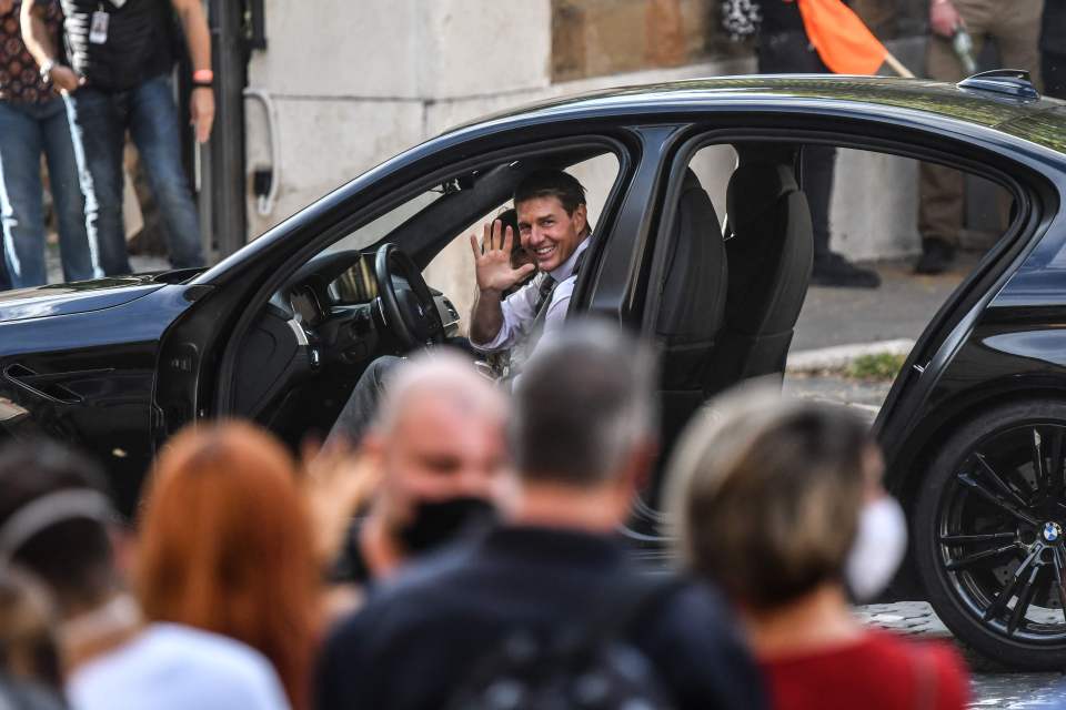 Tom waving at fans