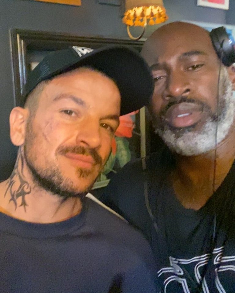 Peter Andre showed off his neck tattoo and scarred face next to Fredi Nwaka