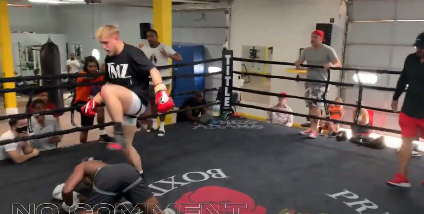 Paul steps over his sparring partner after putting him on the canvas 