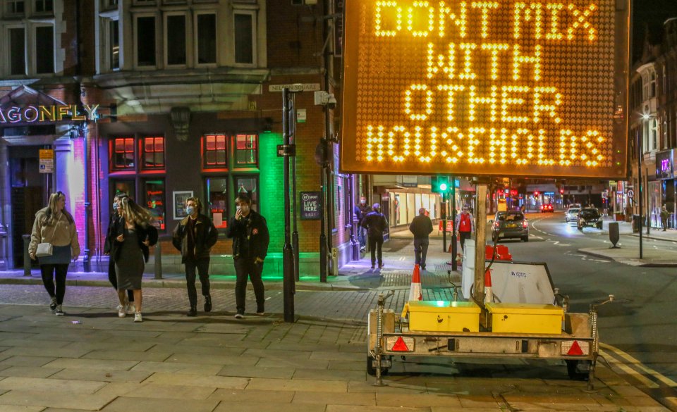 A sign in Bolton, Lancs, warns people not to mix with other households