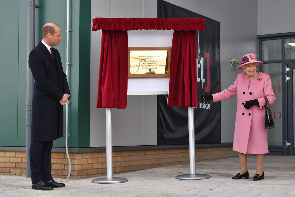 The Queen unveils a plaque with the Duke of Cambridge