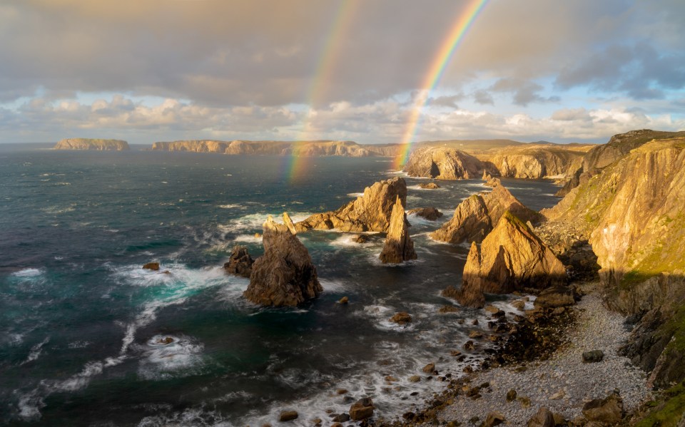 A spectacular double rainbow shot at Mangersta sea stacks, Isle of Lewis, Scotland by Richard Fox