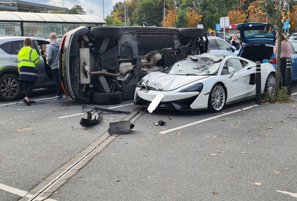 A white McLaren coupe collided with an Audi Q5 in a Sainsbury's car park