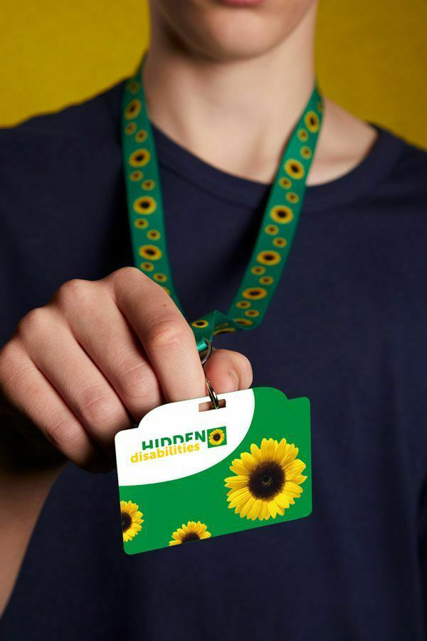 The sunflower lanyard indicates a hidden disability and can be worn to show you are exempt from wearing a face mask