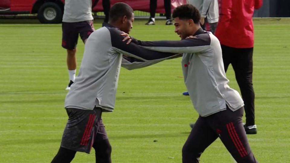 Serge Gnabry (right) comes into close contact with David Alaba in training before testing positive for Covid-19