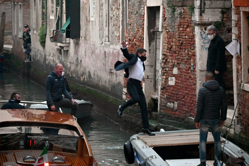 A masked Cruise was seen jumping between boats on the city's iconic canals