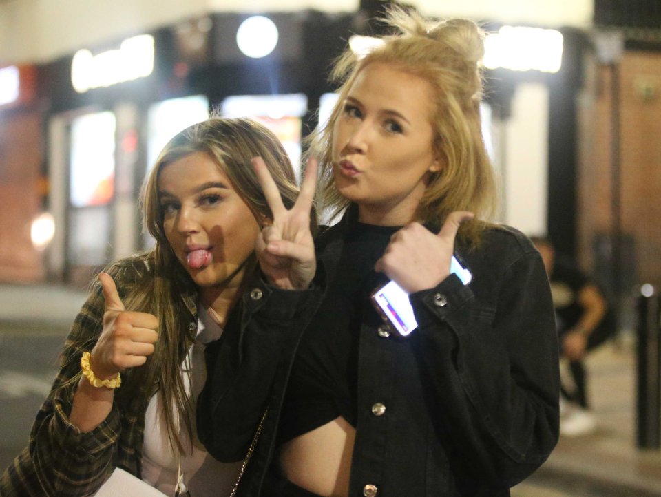 Two friends pose for a picture during a night out in Sheffield yesterday