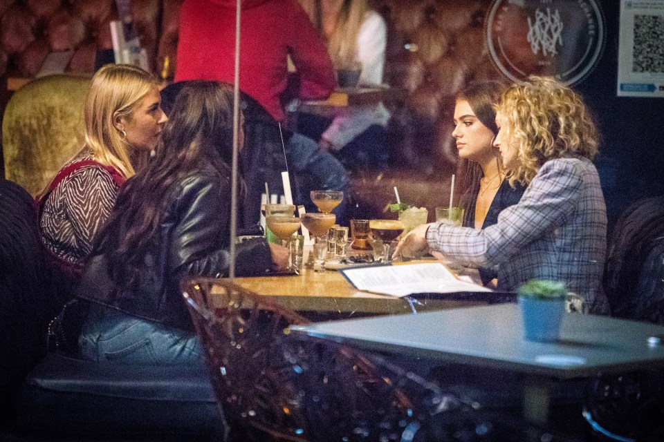 Friends grab a drink in Manchester last night