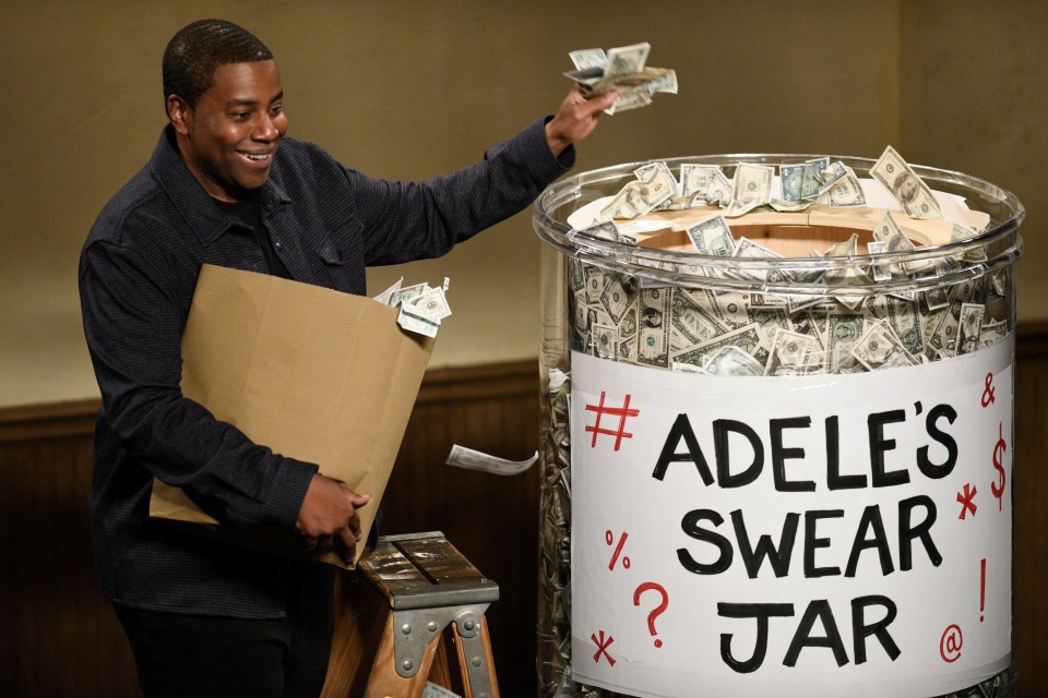 SNL comedian Kenan Thompson stands on a stepladder to peak into the swear jar