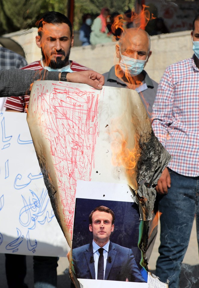 An image of Macron is burned during a protest at the Palestine Technical University in al-Aroub, north of Hebron, West Bank