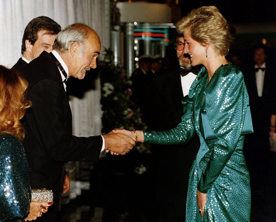 Princess Diana shaking hands with Sean Connery at a reception