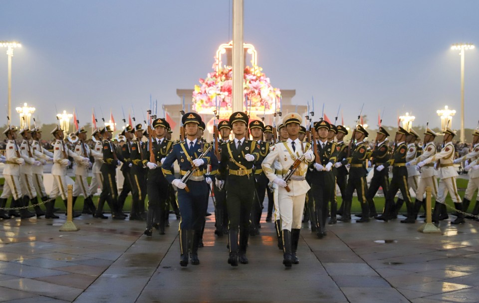 Soldiers of the People's Liberation Army march in Tiananmen Square