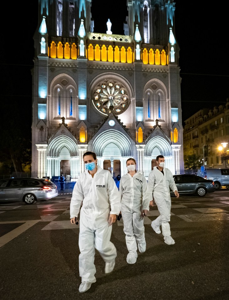 Forensics officers leave the church as they investigate the attack