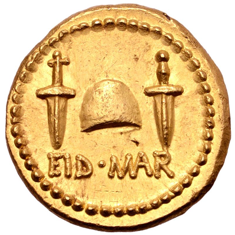 The back of the coin depicts daggers, and references the Ides of March, marking the date of Caesar's death