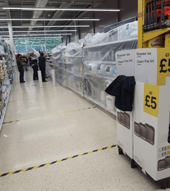 Staff in a Tesco in Wales were seen covering up 'non-essential' items including sheets and duvets