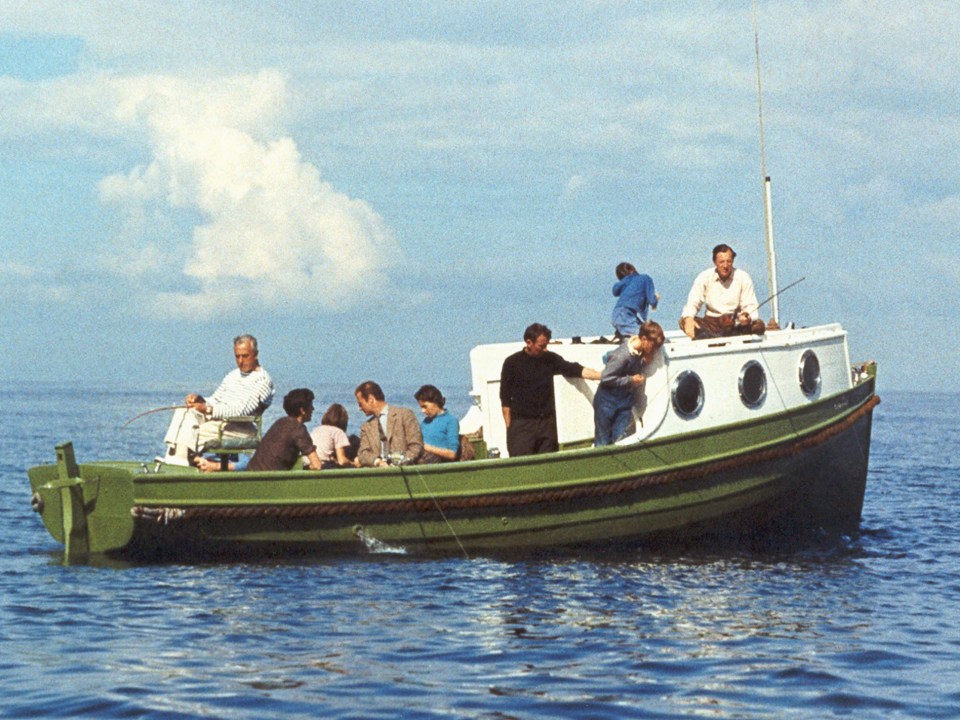 Lord Mountbatten and his family fishing from his boat Shadow V in 1970