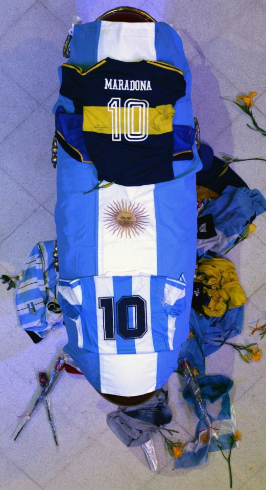 Diego Maradona at Casa Rosada, Buenos Aires, lies draped in the Argentine flag and his famous No 10 shirt