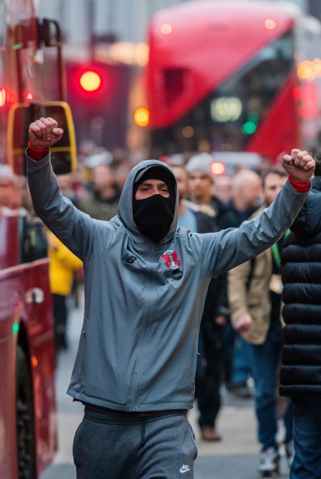 A man in a mask marches in Central London