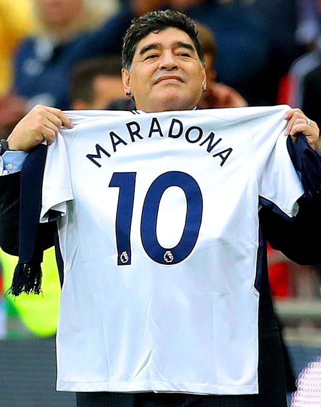 Maradona parades a Tottenham shirt during before their game with Liverpool at Wembley in 2017