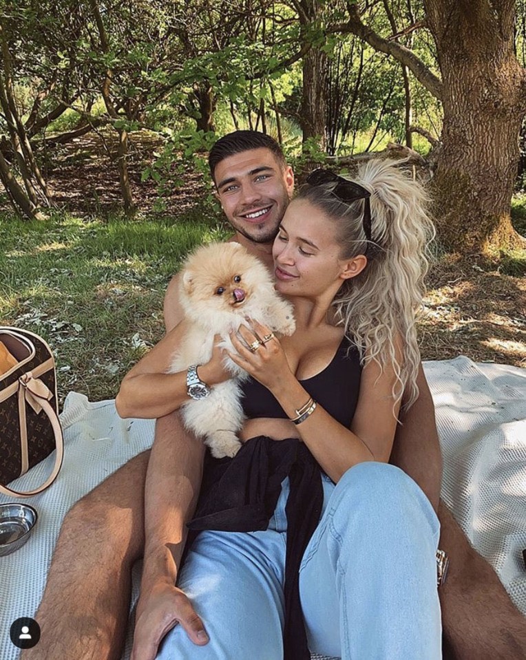 Tommy and Molly-Mae with their puppy that died 