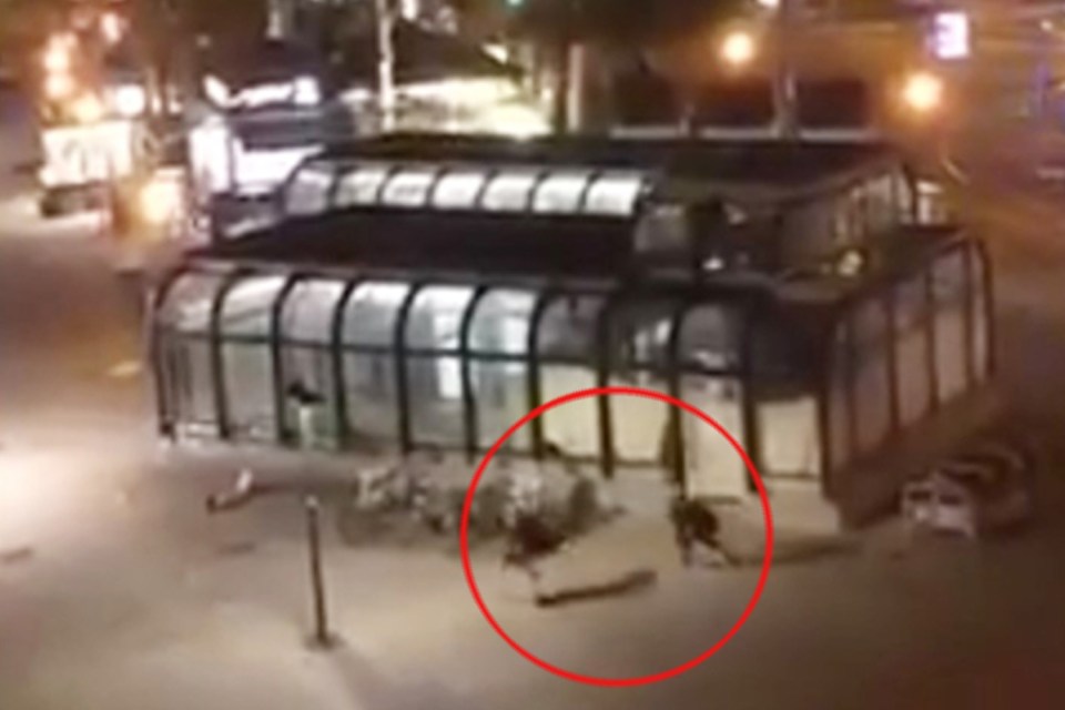 This is the moment the two friends run from the gunman after helping a woman