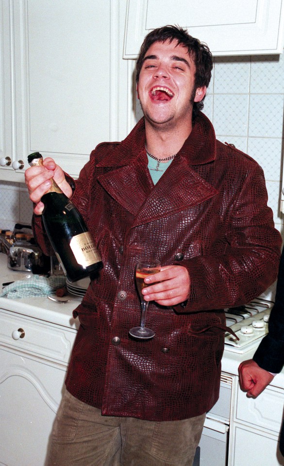 Singer Robbie Williams drinking at his home shortly after leaving Take That