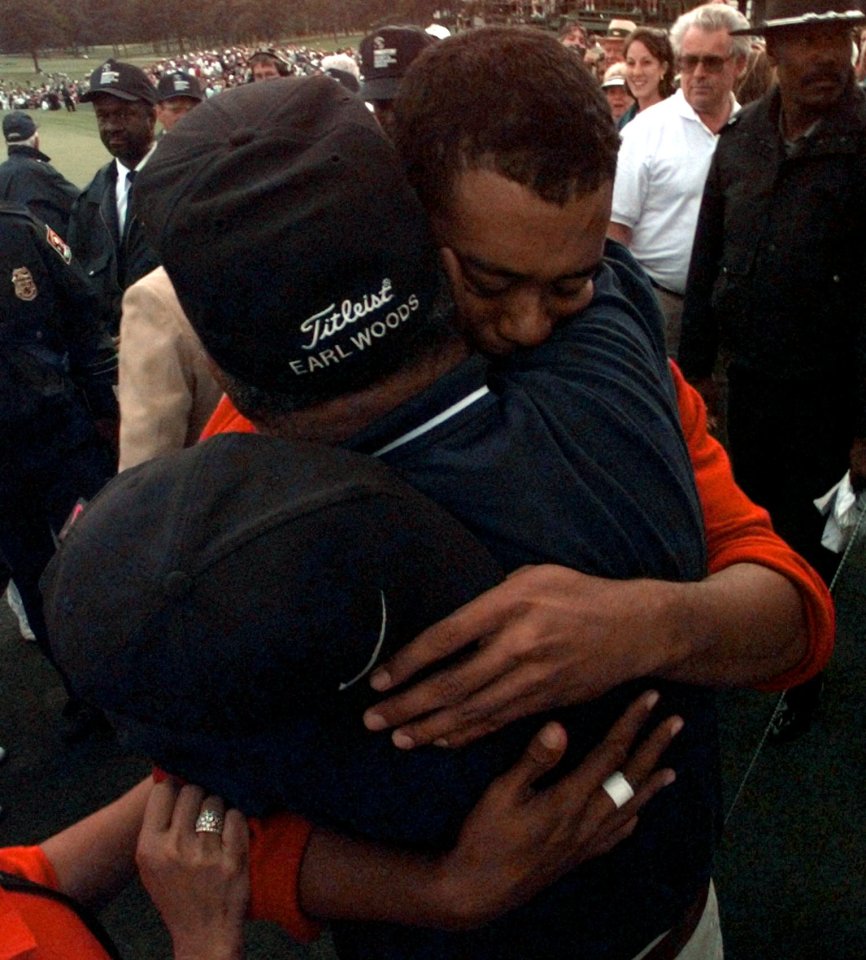 And the megastar said it reminded him of hugging his dad Earl after his first win in 1997