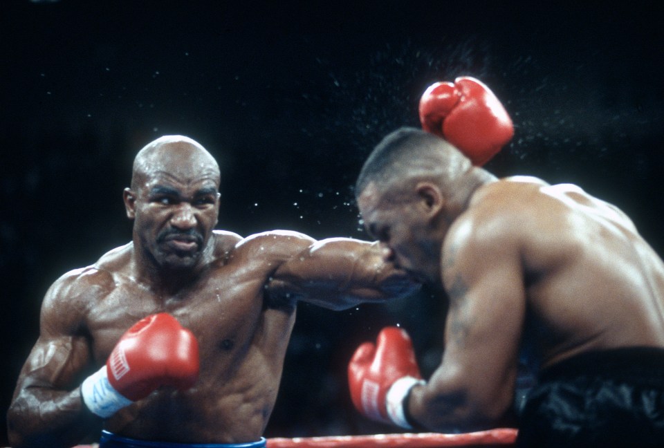 Evander Holyfield on his way to victory against Mike Tyson in their first meeting in 1996