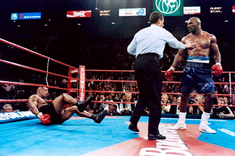 Holyfield puts Tyson on the canvas in the sixth round of their 1996 clash