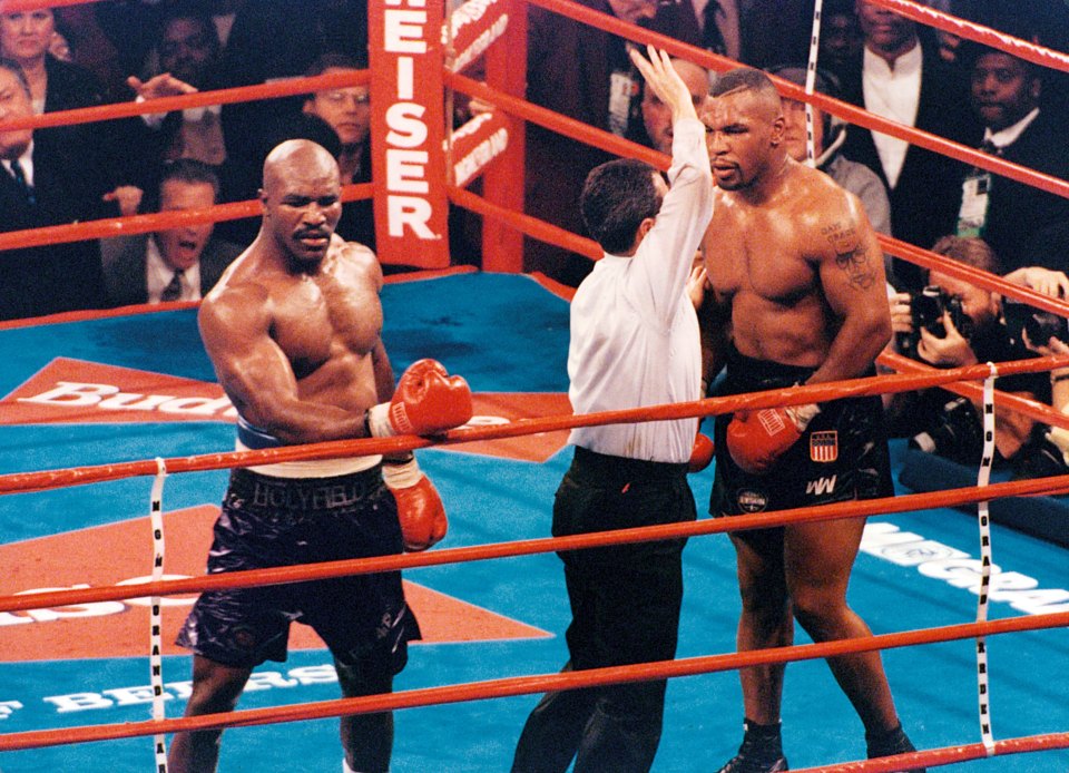 The referee stops the fight in the 11th as Holyfield beats Tyson