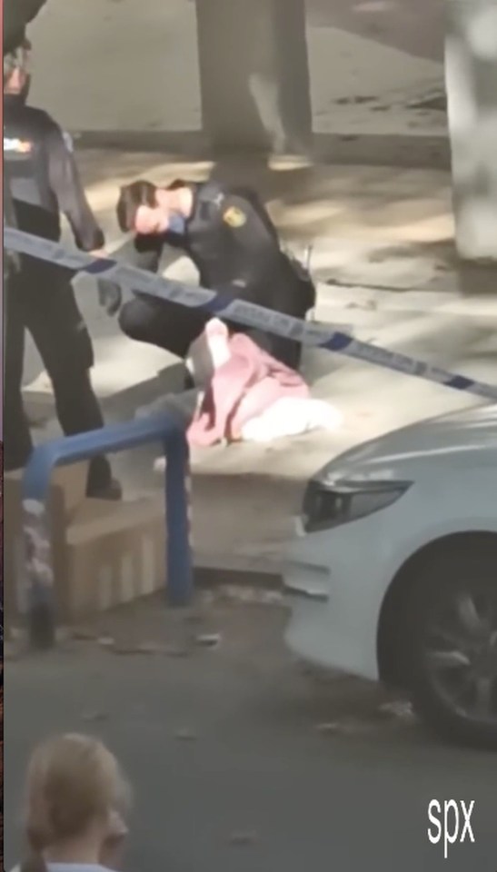 A Spanish police officer examines the contents of the bag, allegedly dumped by a convicted robber nicknamed “The Mexican”