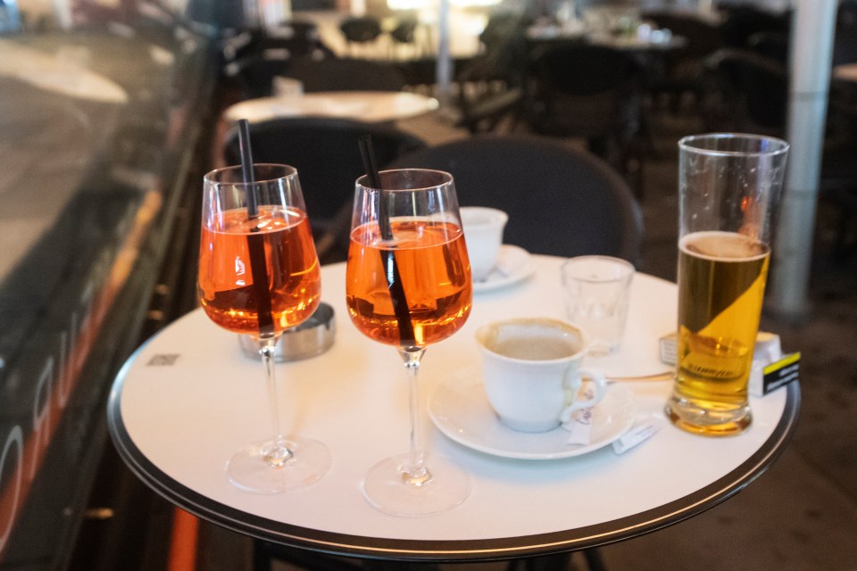 Half empty glasses are seen in a cafe after exchanges of gunfire in Vienna