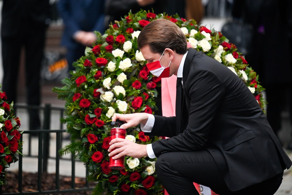 Chancellor Sebastian Kurz lights a candle at the scene 