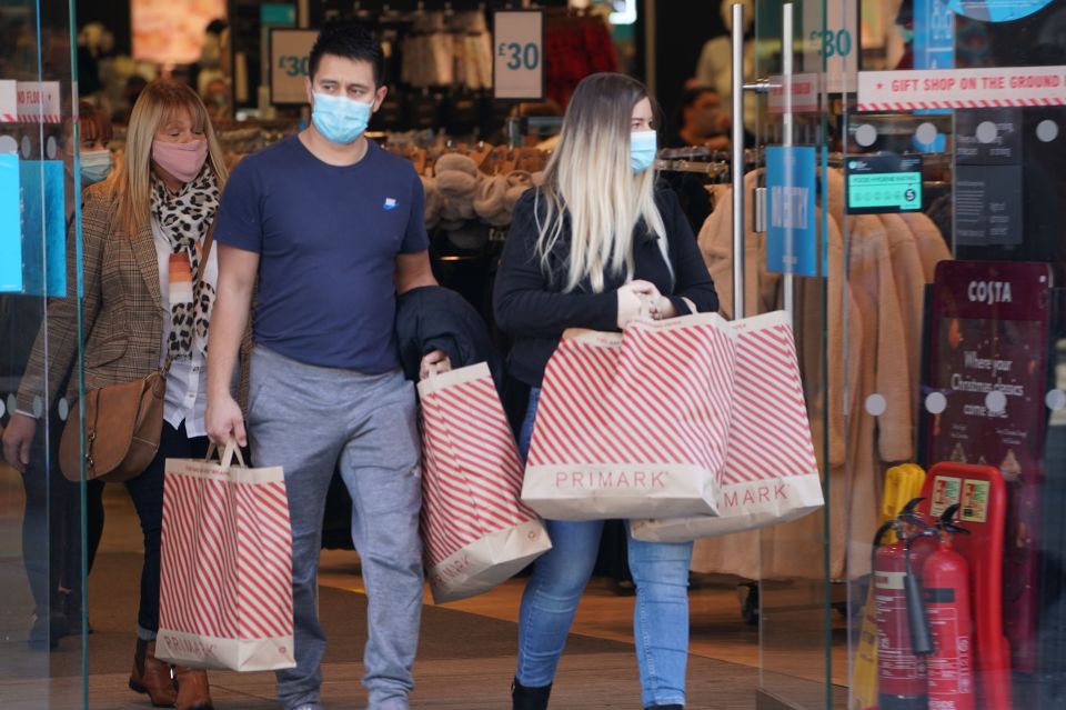 People emerged from the store with bags of clothes in Newcastle, ready for lockdown 2.0