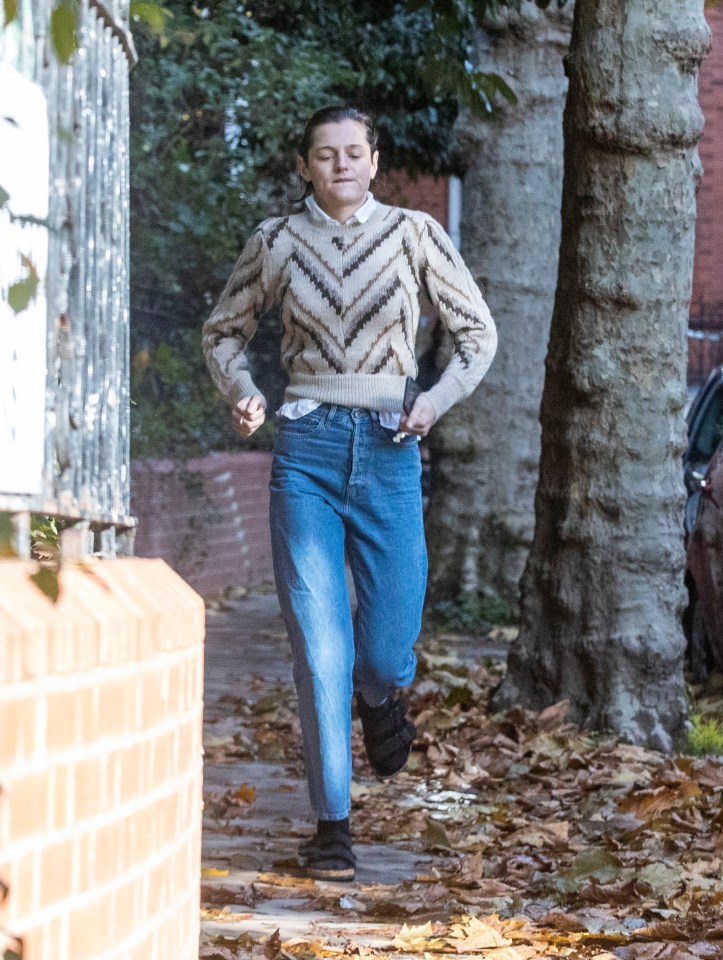 She was spotted in North London walking her dog before making a mad dash to get out of the rain