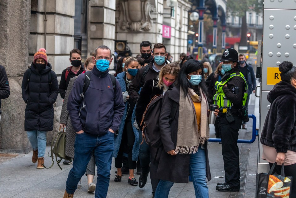 Cops making sure people had masks on as they used the London Underground