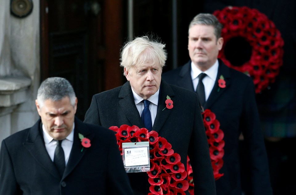 Boris Johnson carried a wreath during the service